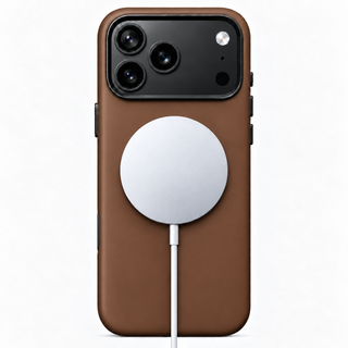 Tanner brown leather iPhone case with a MagSafe charger attached